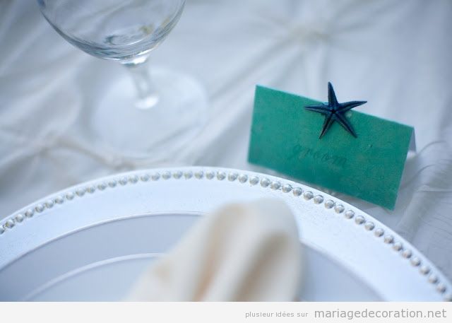 Décoration mariage pas cher, étoile de mer sur la carton avec le nom des invités